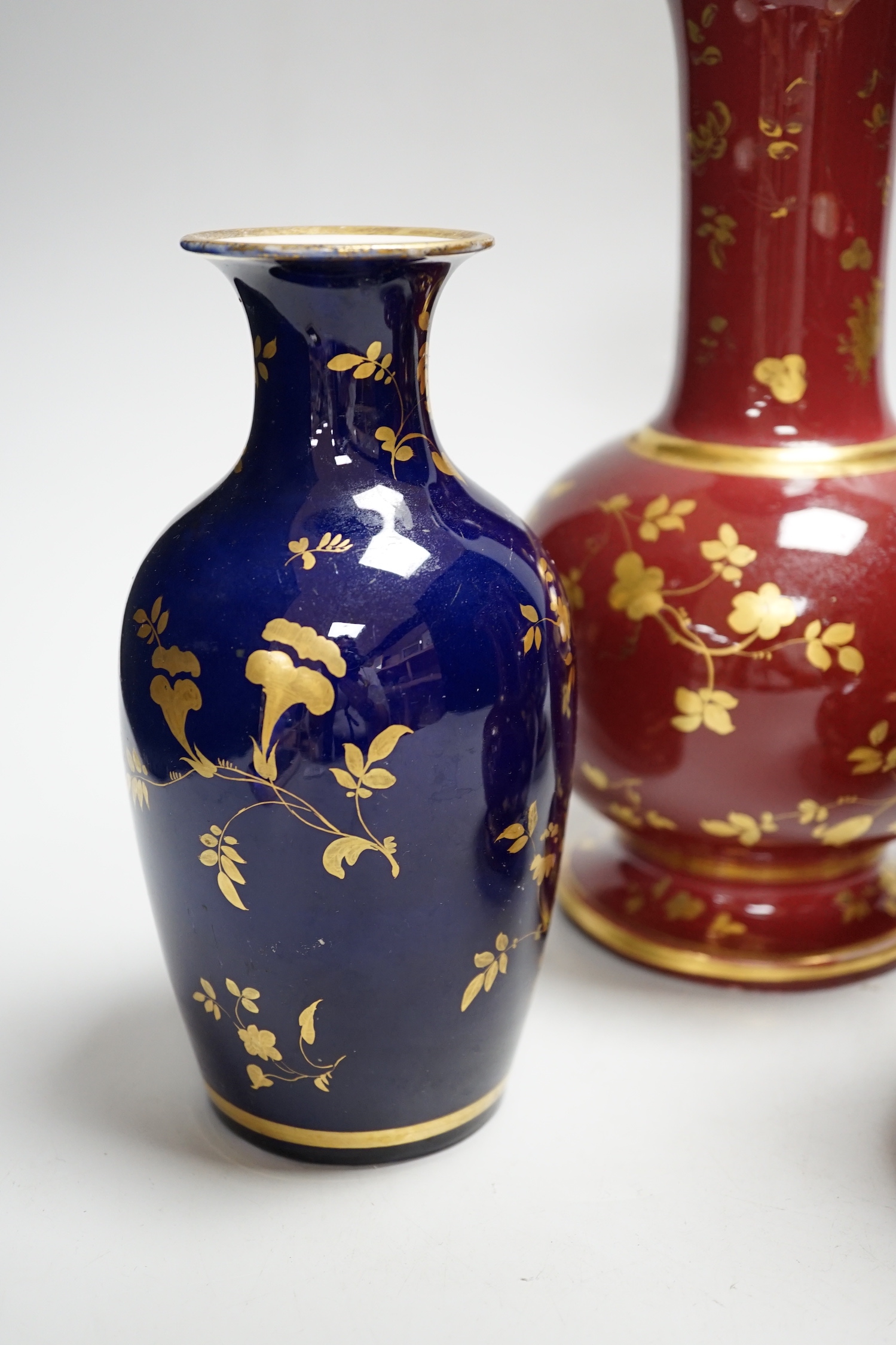 A pair of late 19th century French porcelain vases, and two others, tallest 25cm high